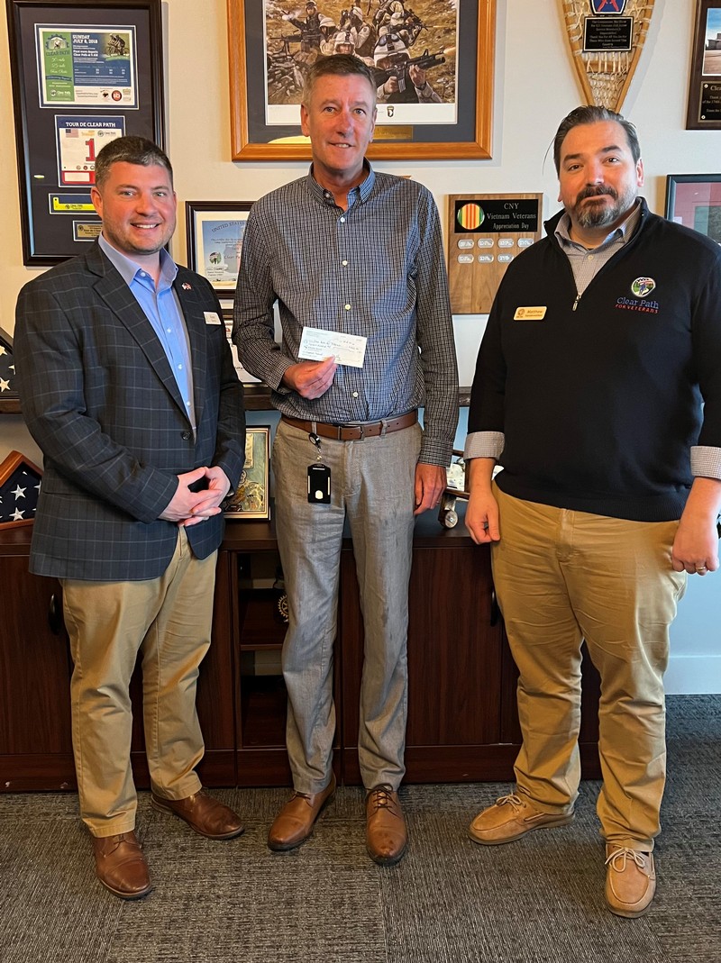 Alex Behm, Executive Director, Clear Path for Veterans (left), Andy McLane, Business Development Officer, Empower FCU (center) and Matt Vanderwerken, Director of Operations, Clear Path for Veterans (right) pose for a check presentation in Syracuse, NY.  Clear Path for Veterans empowers service members, Veterans, and their families through supportive programs and services in a safe, respectful environment. 