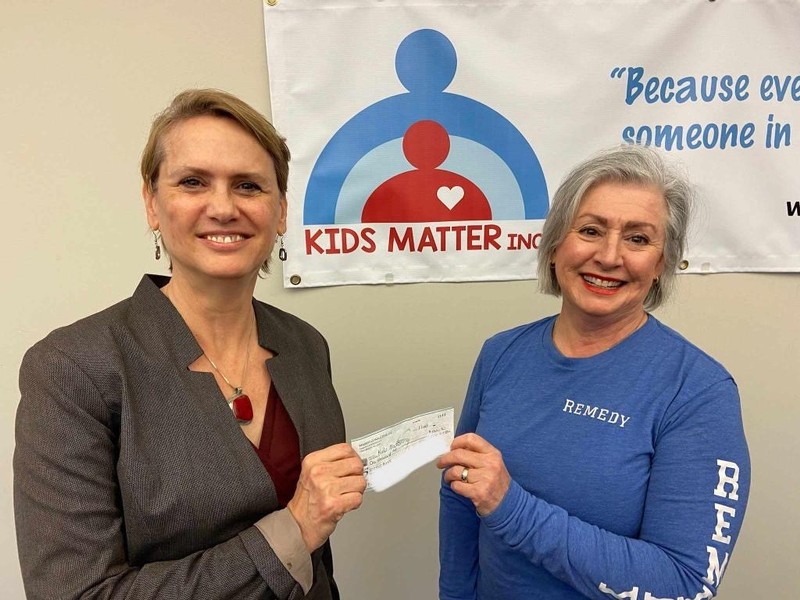 Julie Callaway of Remedy Consulting presenting check to Susan Conwell, Executive Director, of Kids Matter Inc. located in Milwaukee, Wisconsin.