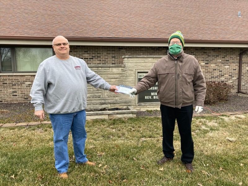 John Gardner, President & CEO of Peoples Bank & Trust, presenting check to Bill Kerns, representing Taylorville Ministerial Alliance and Missions for Taylorville in Taylorville, IL.