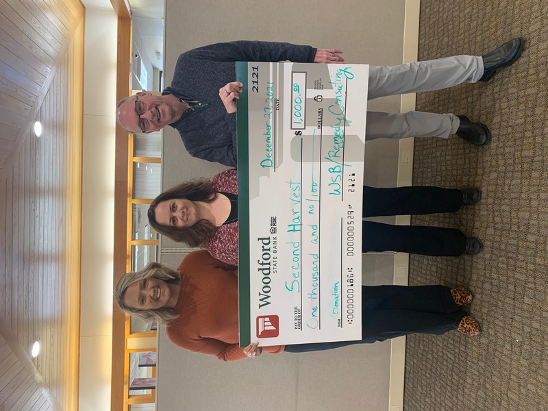 Pictured (left to right): Mandy Johnson (Branch Manager, Woodford State Bank-Darlington Office), Shyntel Owen (Second Harvest), and Scott DeNure, President & CEO, Woodford State Bank presenting check to Second Harvest Food Bank in Darlington, WI.